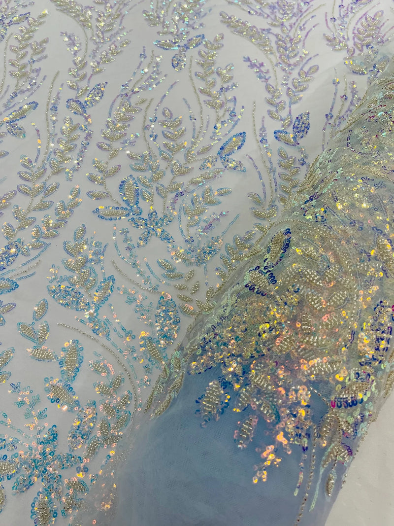 Beaded Iridescent Leaf Design - Clear on Baby Blue - Leaf Sequins Bead Design Mesh Fabric by yard