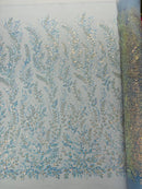 Beaded Iridescent Leaf Design - Clear on Baby Blue - Leaf Sequins Bead Design Mesh Fabric by yard