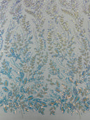 Beaded Iridescent Leaf Design - Clear on Baby Blue - Leaf Sequins Bead Design Mesh Fabric by yard
