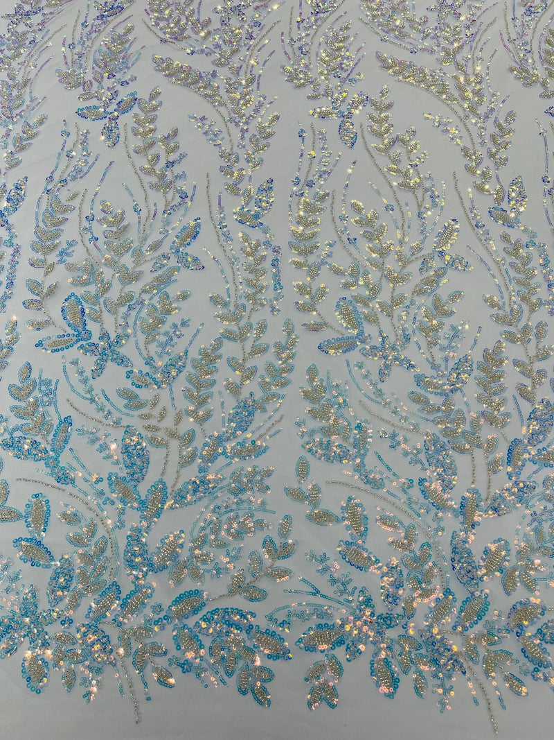 Beaded Iridescent Leaf Design - Clear on Baby Blue - Leaf Sequins Bead Design Mesh Fabric by yard