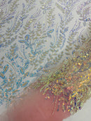 Beaded Iridescent Leaf Design - Clear on Light Pink - Leaf Sequins Bead Design Mesh Fabric by yard