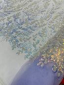 Beaded Iridescent Leaf Design - Clear on Lilac - Leaf Sequins Bead Design Mesh Fabric by yard