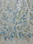 Beaded Iridescent Leaf Design - Clear on Lilac - Leaf Sequins Bead Design Mesh Fabric by yard