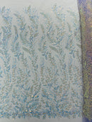 Beaded Iridescent Leaf Design - Clear on Lilac - Leaf Sequins Bead Design Mesh Fabric by yard