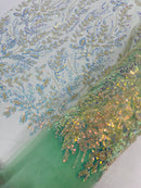 Beaded Iridescent Leaf Design - Clear on Mint Green - Leaf Sequins Bead Design Mesh Fabric by yard
